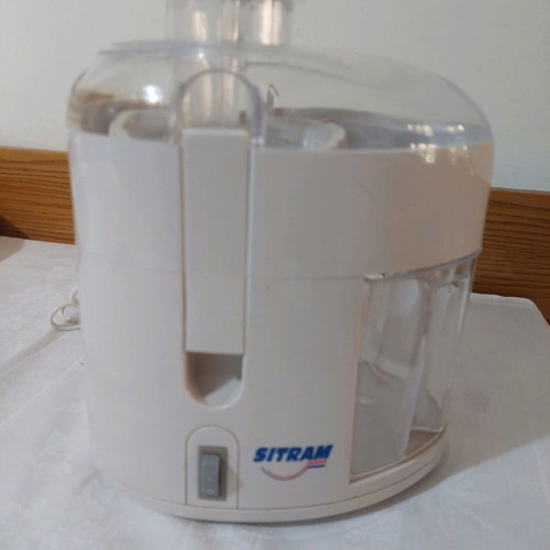 Sitram juicer and metal fruit cutter used