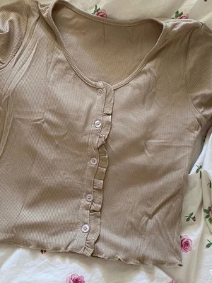 Set of 2 short-sleeve tops with ruffle details and buttons, new, size small