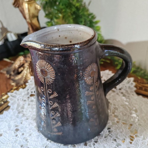 Retro ceramic milk jug with embossed flowers