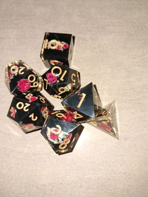 Black D&D dice set with red rose design