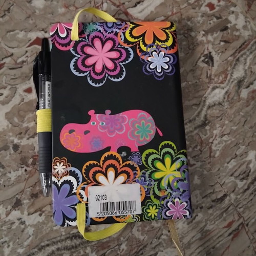 Notebook with hard cover and colorful floral design, like new