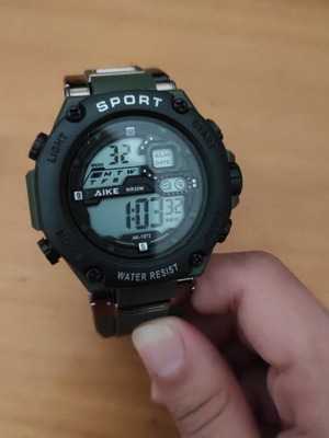 Digital wristwatch khaki like new, men's with pedometer and LED light