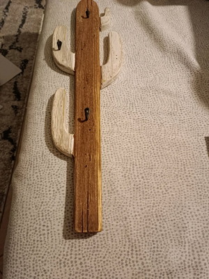 Decorative hanger used with minor damage and missing hook