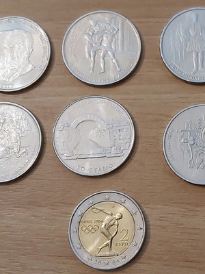 7 ВЪЗПОМЕНАТЕЛНИ МОНЕТИ ОТ ОЛИМПИЙСКИТЕ ИГРИ В АТИНА 2004 - 6 ОТ 500 ДРАХМИ И ЕДНА ОТ 2 ЕВРО