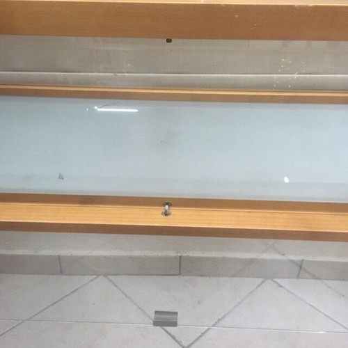 Console used with wooden frame and glass surfaces