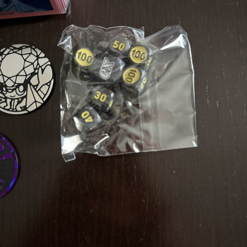 Pokémon Sleeves with Coins and Dice new from Pitch Black and Chaos Rising ETB