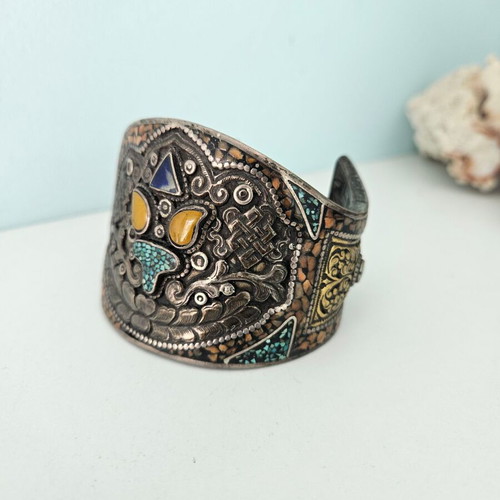 Handmade carved bracelet used with turquoise and silver