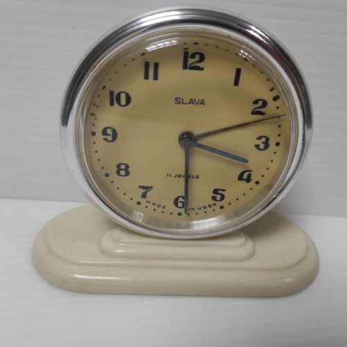 Slava mechanical alarm clock used, analog table clock