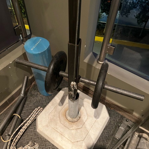 Training rack with barbell and pulley system