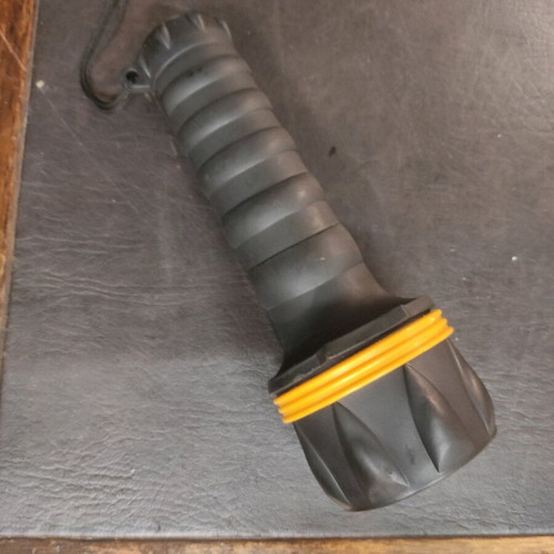 Handheld flashlight used, black with yellow