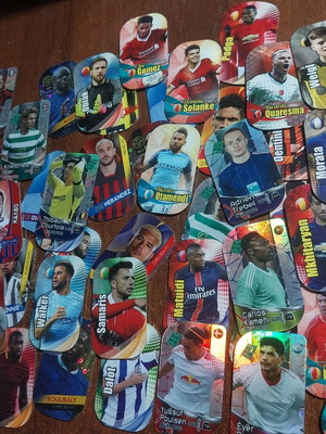 Metal tags with football players, pack of 45, like new