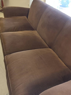 Handmade sofa used with brown velvet upholstery and walnut legs