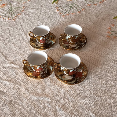 Coffee cups used, set of 4 with traditional designs