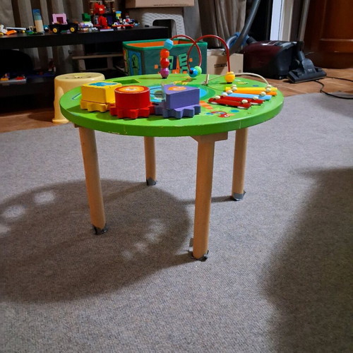 Wooden activity table used for preschool children