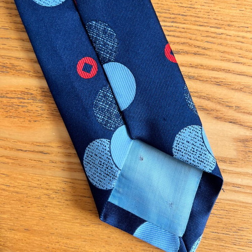 Vintage men's tie blue with geometric polka dots, retro style