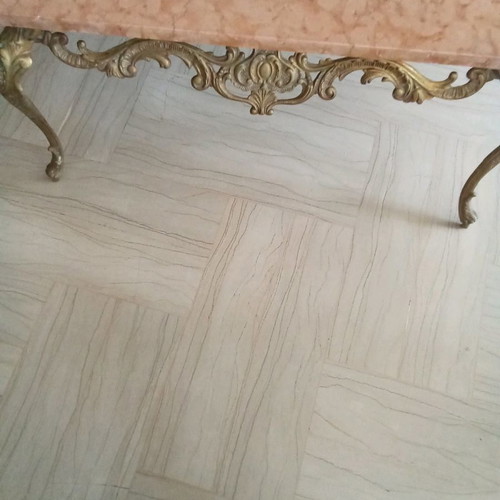 Bronze coffee table used with pink marble