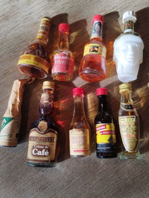 Mini bottles like new, 9 sealed and 3 opened, all glass