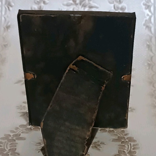 Small painting used in old metal tabletop frame with glass