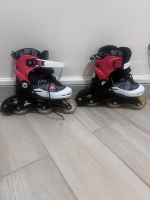 Athlopaidia inline skates adjustable size 26-29 with 2 pairs protective gear like new