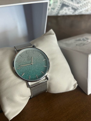 Season Time ρολόι χειρός γυναικείο ασημί λουράκι με γαλάζια αγκράφα καινούργιο