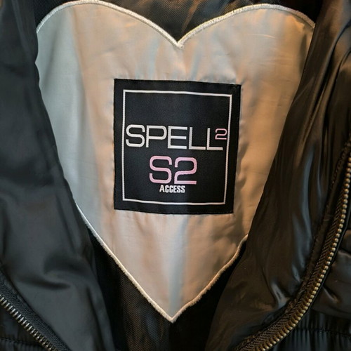 Black sleeveless Spell jacket size medium like new with bow at back