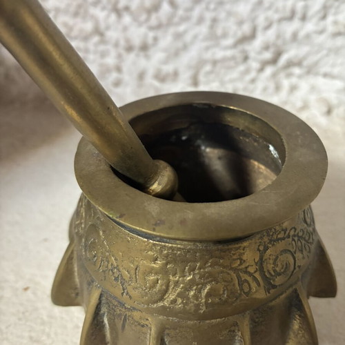 Bronze mortar and pestle used, antique with ribs and engraved design