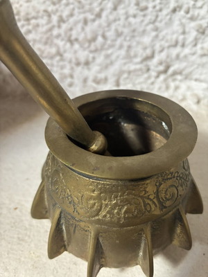 Bronze mortar and pestle used, antique with ribs and engraved design