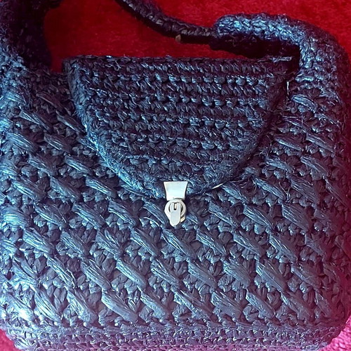 Handmade black raffia handbag used with silver turn-lock clasp
