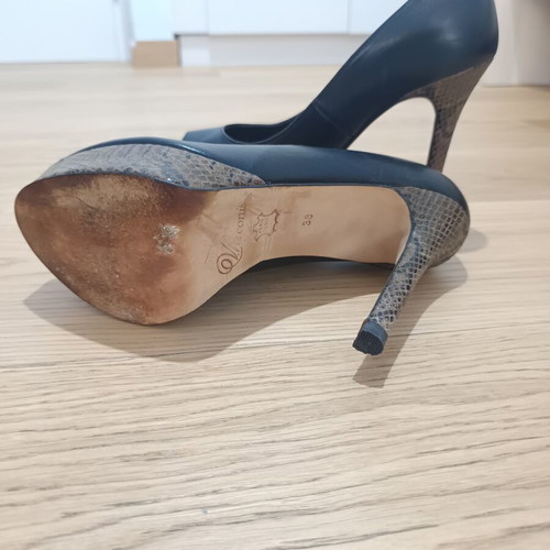 Peep toe heels used, leather with animal print platform