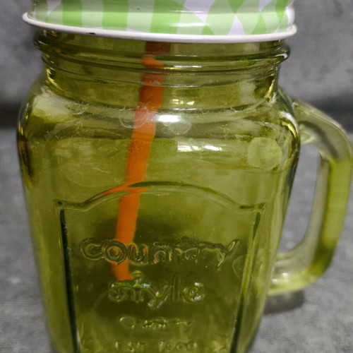 Glass cup with straw used, straw needs replacement