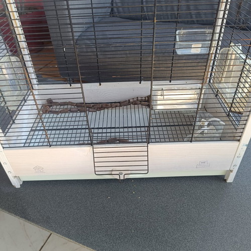 Wooden birdcage used with steel bars and plastic door