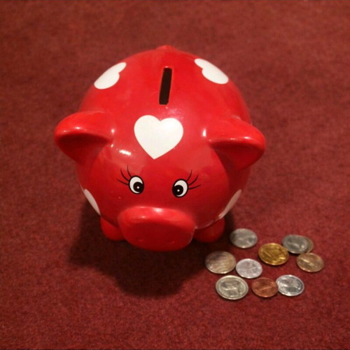 Ceramic piggy bank with hearts like new