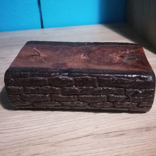 Handmade candle in wood log shape like new