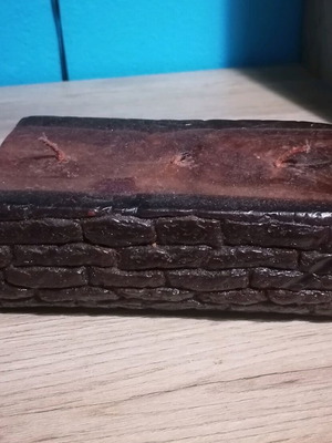 Handmade candle in wood log shape like new