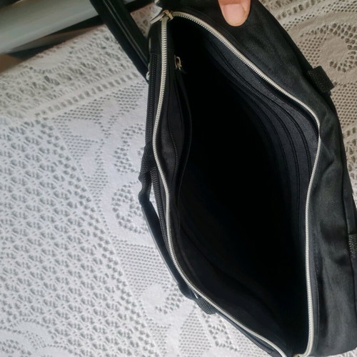 Laptop bag like new, black with multiple compartments and adjustable shoulder strap