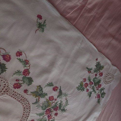 Handmade counted embroidery with handmade lace used