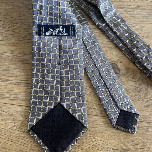 Hermes silk tie like new with geometric basketweave pattern in blue and yellow
