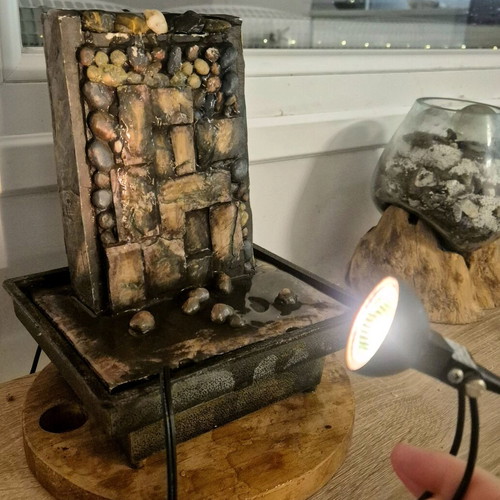 Decorative water fountain used with light
