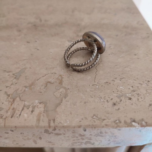 Faux ring with purple stone used, adjustable size