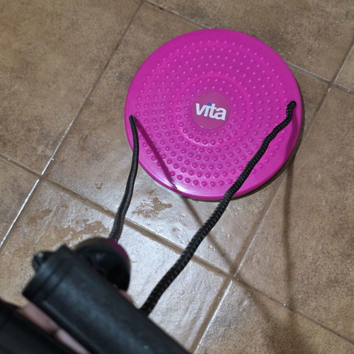 Gym equipment like new, pink rotating body exerciser