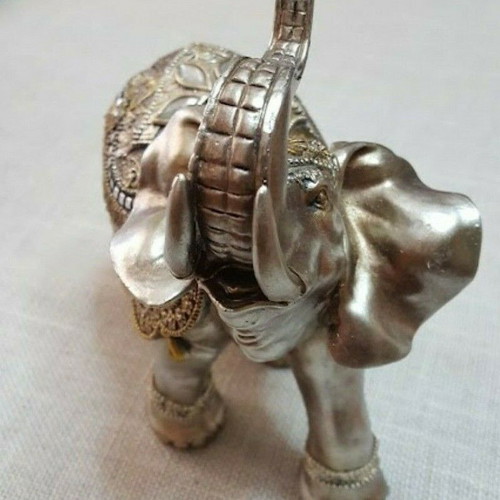 Handmade wooden elephant used with decorations and crystals