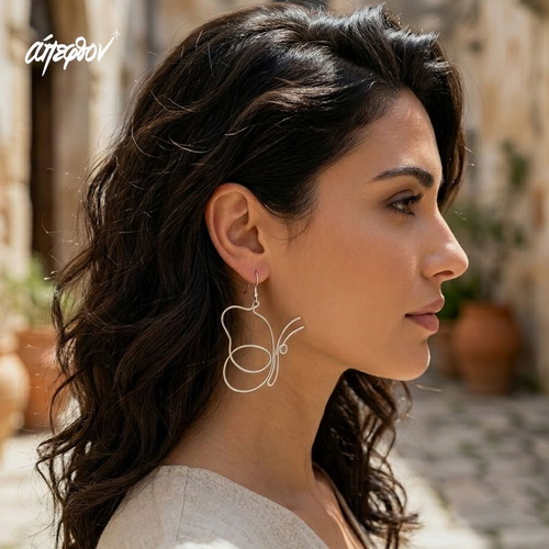 Lunar Chrysalis earrings new, asymmetrical silver butterflies
