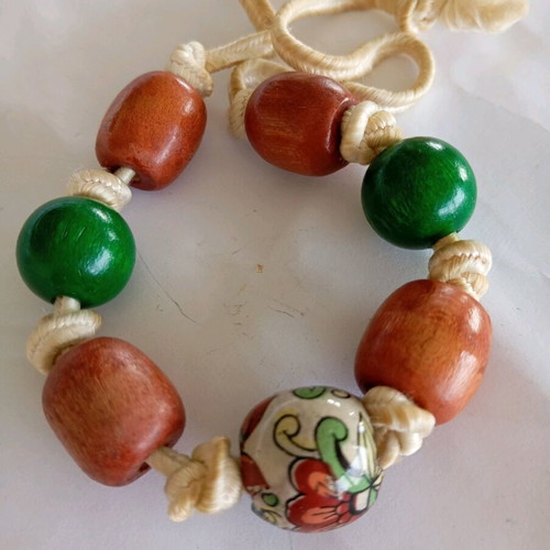Handmade bracelet with cord and wooden beads green and brown