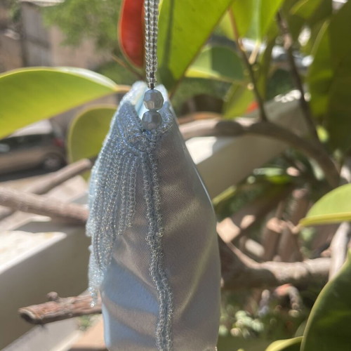 Light blue satin handbag with beads