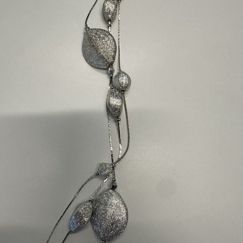 Triple necklace with silver pebble-like elements
