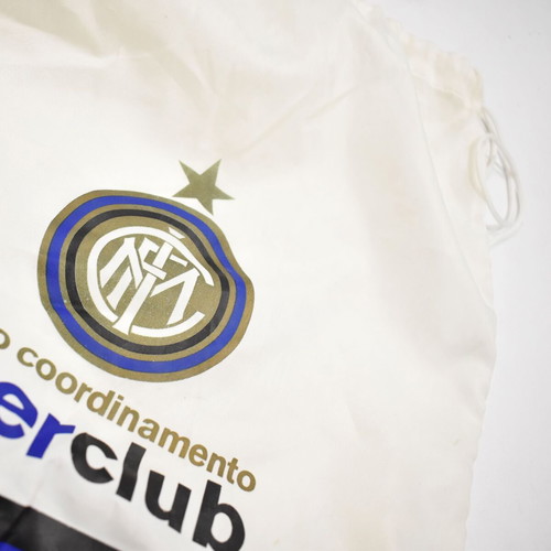 Inter collection with scarves, pennants, cufflinks, magazines and backpack