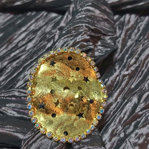 Large ring used, gold color with small strass