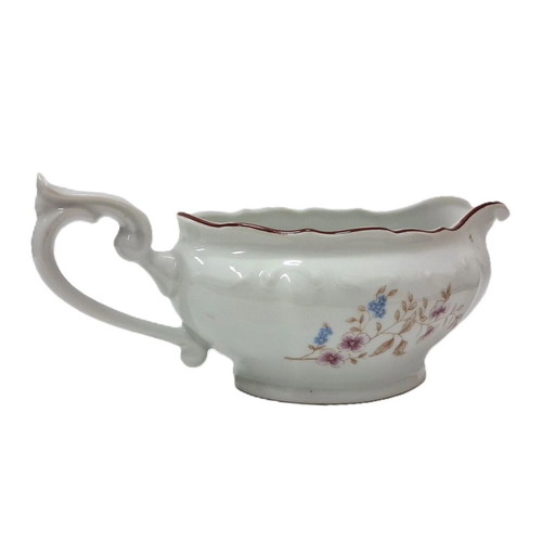 Vintage porcelain sauceboat with floral motif like new