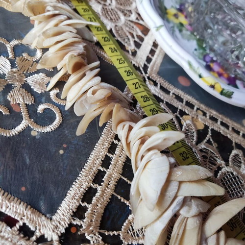 Vintage necklace made of natural shells in boho brutalist style, used