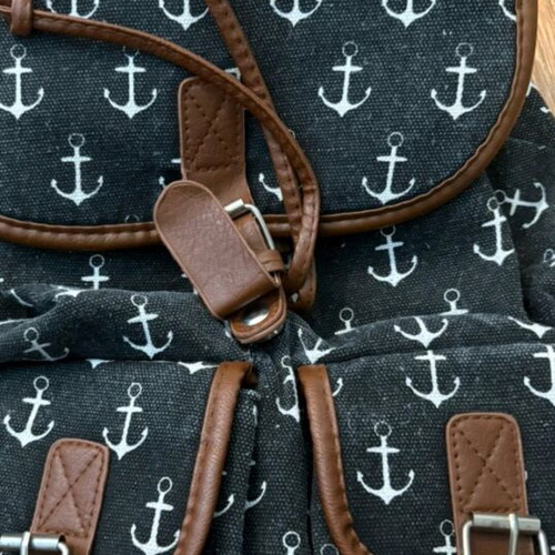 Backpack with anchor design and leather details like new